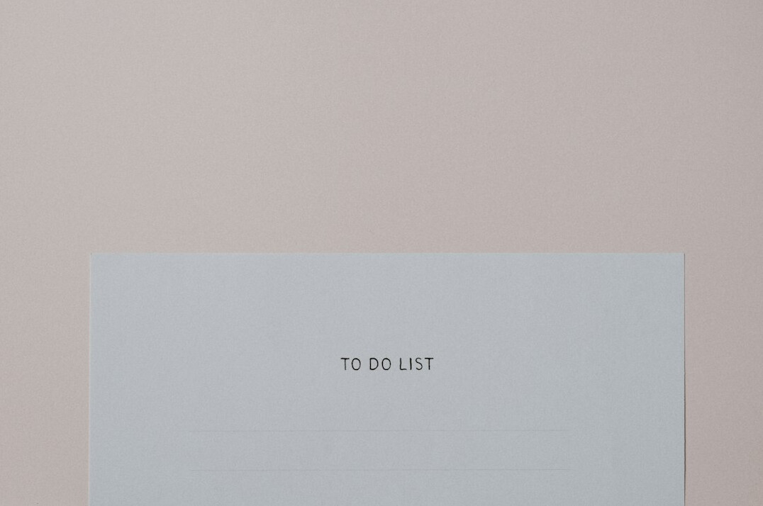 Notebook with to-do list and pen on a desk