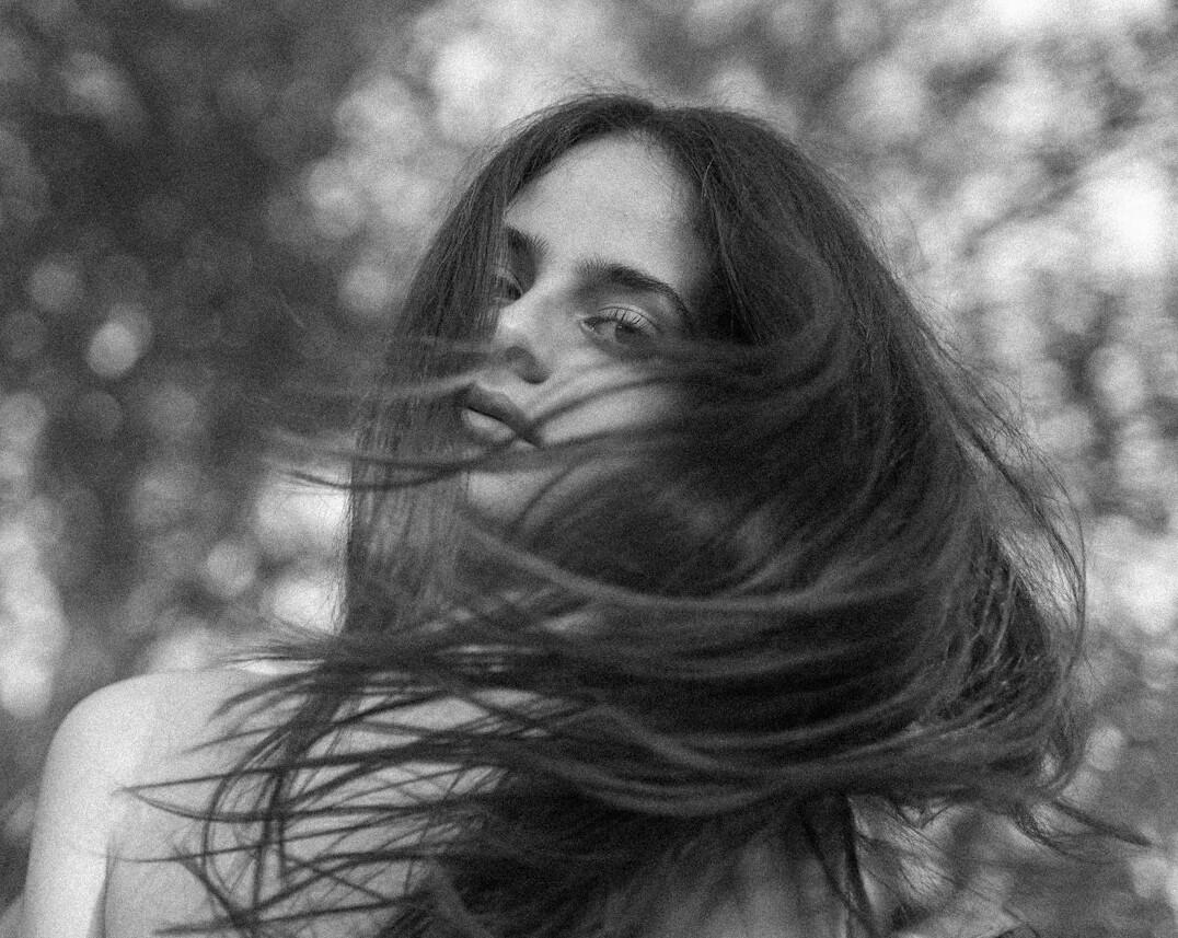 Portrait of a smiling woman with long hair