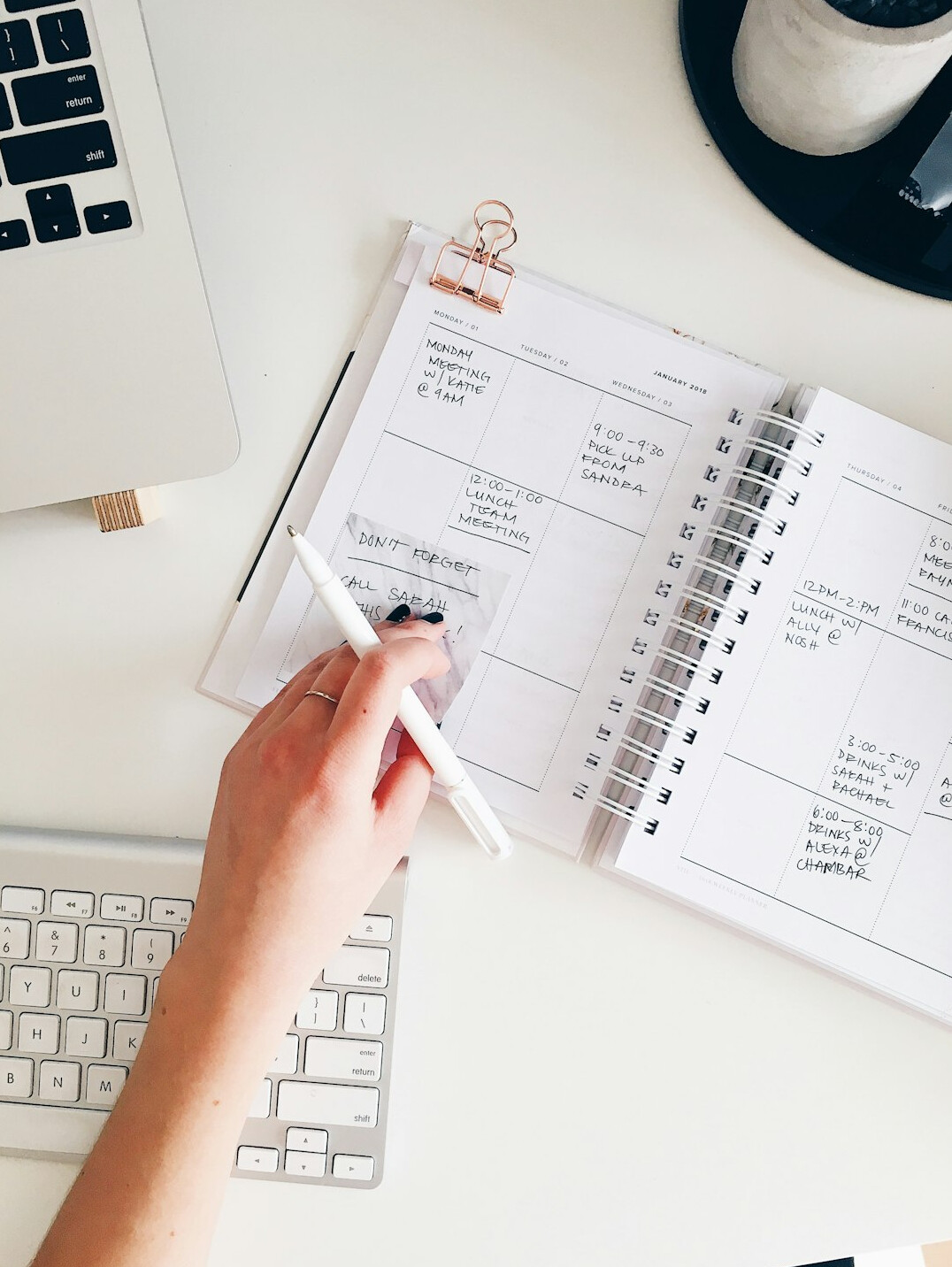person planning day with notebook