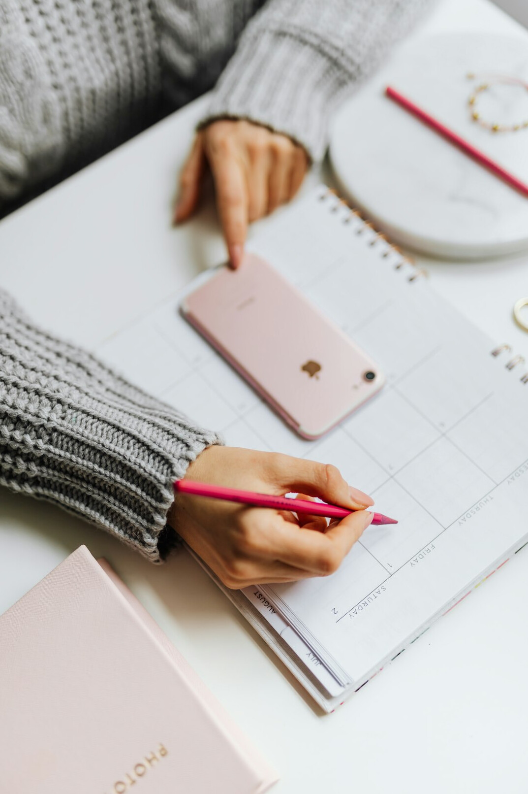 person planning day with notebook